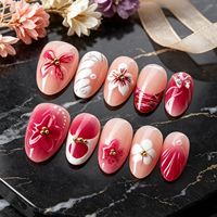 Faux ongles courts à porter, forme amande, effet œil de chat rose-rouge, design papillon 3D, haute qualité, effet éclaircissant, pour le marché international