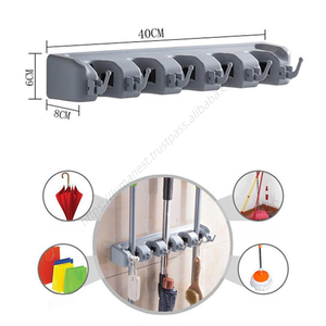Support mural multifonctionnel en plastique pour balais et serpillères, idéal pour la cuisine et la maison, vente chaude, emballage en boîte colorée - Product Image 1