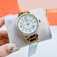Montre élégante pour femmes, boîtier rond en cristal, cadran en nacre, date, bracelet en acier inoxydable, lunette en strass, montre-bracelet pour dames