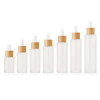 Vente en gros de flacons compte-gouttes en verre givré de 20 à 100 ml, couleur personnalisée, avec bouchon en bambou, pour sérum, huile essentielle, emballage cosmétique