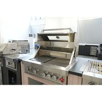 Îlot de cuisine extérieur trois pièces avec évier, armoire à boissons et barbecue intégré