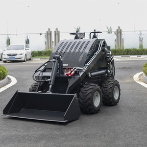 Chargeuse compacte polyvalente avec godet à changement rapide, fourche et souffleuse à neige pour travaux de construction et agricoles efficaces - Product Image 1