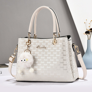 Bolso Tote Casual para Mujer Jemutaz con Adorno de Pompón, Correa Extraíble, Cierre de Solapa Clásico, Bolso de Mano de Microfibra para Uso Diario - Product Image 1