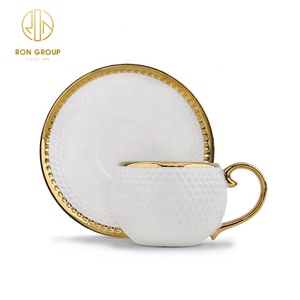 Juego de Tazas de Té de Porcelana Creativas de Forma Redonda en Color Blanco <span class=keywords><strong>y</strong></span> Dorado para Restaurante de Lujo, <span class=keywords><strong>Plato</strong></span> de Cerámica, <span class=keywords><strong>Taza</strong></span> de <span class=keywords><strong>Café</strong></span> <span class=keywords><strong>y</strong></span> Platillo de Cerámica - Product Image 1