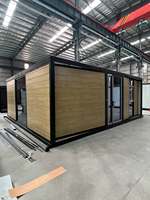 Maison conteneur biplan à toit plat extensible de 20 pieds avec panneaux muraux en verre certifiés CE