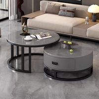 Ensemble de tables basses gigognes de luxe moderne avec plateau rond en pierre frittée, structure métallique et tiroir de rangement pour salon et petit appartement