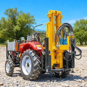 Foreuse hydraulique jaune montée sur tracteur rouge pour le forage de puits d'eau - Product Image 1