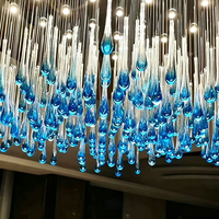 Lustre moderne suspendu en cristal en forme de goutte d'eau avec éclairage LED pour hall d'hôtel, villa, duplex, salon et escalier