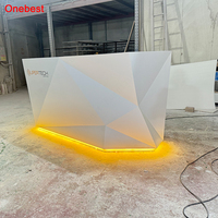 Comptoirs de réception en surface solide au design élégant avec éclairage LED blanc chaud pour clinique ophtalmologique et dentaire