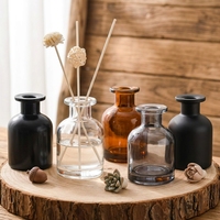 Bouteille diffuseur d'aromathérapie vide en verre ambré mat noir rond de 50 ml et 100 ml avec bouchon en liège