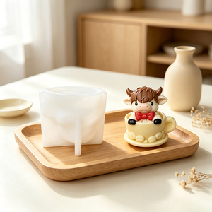 Precioso molde de silicona diseñado como un ternero recién nacido dentro de una taza de té para manualidades DIY - Product Image 1