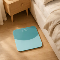 Balance de salle de bain numérique moderne vert turquoise en verre trempé avec affichage LED dissimulé pour pesée personnelle précise à domicile Pro