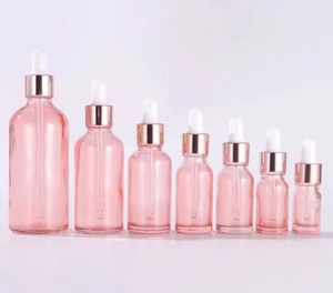 Nouvelles bouteilles d'huile scintillantes cosmétiques vides en verre rose clair avec <span class=keywords><strong>pipette</strong></span> compte-gouttes en or rose rose - Product Image 1