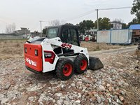 Mini-chargeuse compacte chenillée 4x4 d'occasion à prix abordable, avec godet compact et faible nombre d'heures de fonctionnement