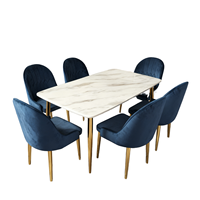 Table à manger moderne de luxe Rikkasi en pierre naturelle rectangulaire pour 6 personnes, avec pieds en acier inoxydable couleur champagne et plateau en marbre
