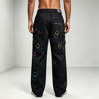 Pantalon cargo rétro brodé uni, coupe droite, avec boucle à la taille, formes géométriques, étiquette en cuir, poches obliques
