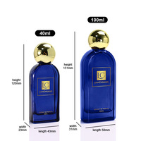 Botol Parfum Kaca Biru Persegi Pipih OLATEC 40 100ML dengan Tutup Bola Emas, Opsi Logo Kustom, Wadah Parfum Mewah