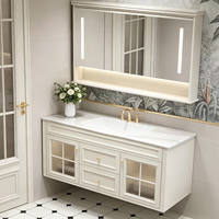 Ensemble de meubles de salle de bain de style français de luxe, armoire flottante blanche crème avec porte en verre cintrée et miroir LED intelligent, OEM ODM
