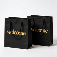 Sacs cadeaux en papier noir premium FB23 avec gaufrage doré « Bienvenue » pour les cadeaux de fête et les cadeaux d'événements
