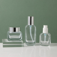 En stock : Ensemble de flacons cosmétiques en verre transparent avec pompe à lotion et pot à crème pour le visage, emballage estampé or pour les soins de la peau