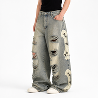 Jean droit vintage délavé pour homme, fabriqué sur mesure, avec déchirures prononcées, effet vieilli, appliqué en forme d'os, coupe droite, en denim
