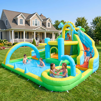 Château gonflable dinosaure avec double toboggan et piscine aquatique avec souffleur