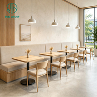 Chaise de restaurant commerciale Ron Group avec structure en bois, table carrée, banquette en tissu moderne et luxueuse pour café