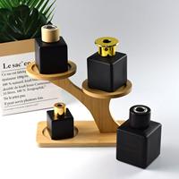 Couleur personnalisée 50 ml 100 ml 150 ml 200 ml Diffuseur de roseau vide carré ambré Bouteille en verre Diffuseur d'arôme noir Bouteille