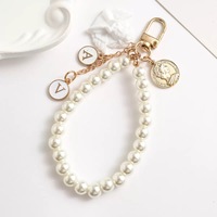 NXQXN Ensemble d'huiles parfumées en forme de couronne de fleurs en perles, porte-clés en alliage de zinc, élégant, rétro, sûr, ornement suspendu pour sac ou téléphone portable, Journée de la Terre