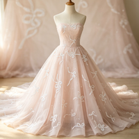 Robes de demoiselle d'honneur en organza rose clair transparent avec nœud brodé de sequins blancs et broderie florale pour l'été (garçons et filles)