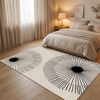 Grand tapis moderne Sunburst 8x10 noir et crème à motif géométrique radial pour salon et décoration intérieure