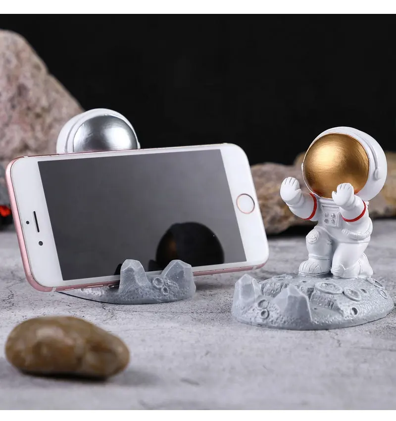 Hot sale resin ornament table phone holder custom creative astronaut image 3d figure for kids gifts mobile phone stand