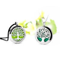 Diffuseur d'huile essentielle d'aromathérapie d'acier inoxydable collier d'arbre creux désodorisant de conception pour des cadeaux