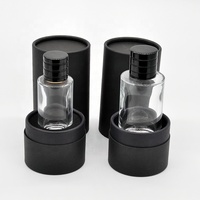 Flacon en verre transparent personnalisé OEM de haute qualité 30ml/50ml/100ml, avec pulvérisateur à pompe, pour soins capillaires, imprimé sérigraphié, dans un coffret cadeau cylindrique de luxe