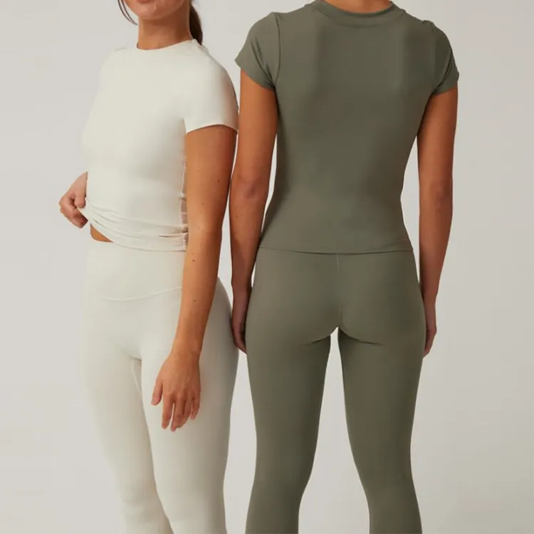 Set di Leggings da ginnastica per Yoga da donna su misura XL taglia Spandex abbigliamento sportivo 2 pezzi Crop Top e gambali solidi Activewear Fitness