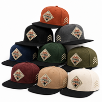 Casquette de baseball à six panneaux texturée avec logo personnalisé et patch brodé pour les marques de streetwear OEM ODM