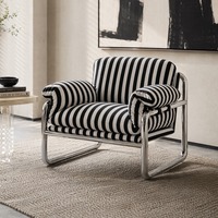 Fauteuil individuel en velours, durable, avec structure métallique et rembourrage en mousse, idéal pour hôtels et salons, design minimaliste.