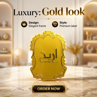 Flacon de parfum de luxe sur mesure en or avec étiquette métallique et plaque nominative miroir haut de gamme