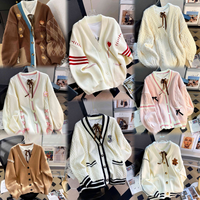 Femmes brodé Floral tricot Cardigan pull tissé à la main épais laine col en v à manches longues bouffantes en gros hiver Cardigan pull