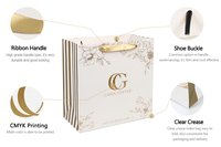 Sac cadeau haut de gamme en carton rigide et papier de qualité supérieure, personnalisé avec impression or, très prisé, doté