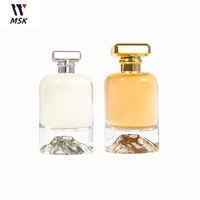 Flacon de parfum rond en verre de luxe 30ml 50ml 100ml avec fond coussiné en forme de cylindre pour l'emballage de cosmétiques et de soins corporels