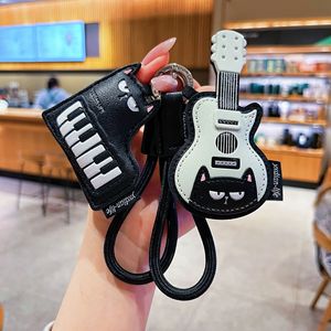 Nouveau Porte-clés en Cuir 2026 avec <span class=keywords><strong>Guitare</strong></span> et Chat, Breloque Piano, Pendentif de Sac Créatif et Adorable pour Filles - Vente en Gros - Product Image 2