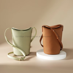 Sac bandoulière haut de gamme en cuir de vachette véritable pour femme, mini sac seau avec fermeture éclair, polyvalent et tendance pour l'automne Tanjing - Product Image 1