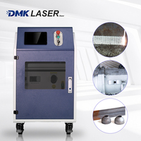 Machine de nettoyage au laser pulsé refroidie par eau DMK GT 2000w pour le bois, les graffitis et la peinture, le cuivre, l'aluminium, la poussière métallique