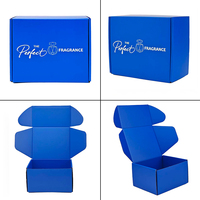 Caja de Envío Azul Personalizada con Logotipo Estampado en Plata para Perfumes, Fabricada con Cartón Corrugado Tipo E, Ideal para Suscripciones de Fragancias