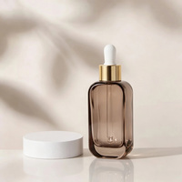 Flacon compte-gouttes en verre transparent de 50 ml à épaule plate avec logo personnalisé pour huile capillaire, sérum, gouttes pour les yeux, sérum de soin de la peau, emballage cosmétique