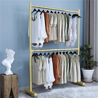 Nordique moderne métal Double barre pliant vêtements tige de suspension audacieux Double couche sol levage sec support Simple nordique salon
