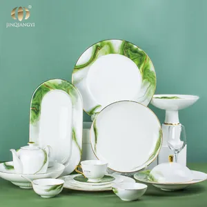 Nouveau design de service d'assiette en porcelaine osseuse à bordure dorée service de vaisselle en gros de vaisselle en céramique de luxe en marbre blanc vert