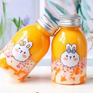 Vaso de plástico Botellas de jugo Botella de jugo de plástico <span class=keywords><strong>PET</strong></span> vacía Botella de bebida redonda única transparente sin BPA con tapas - Product Image 2