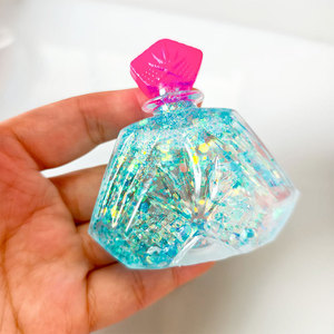 Juguete Antiestrés de TPR con Forma de Botella de Perfume, con Polvo Dorado, para Regalo - Product Image 3
